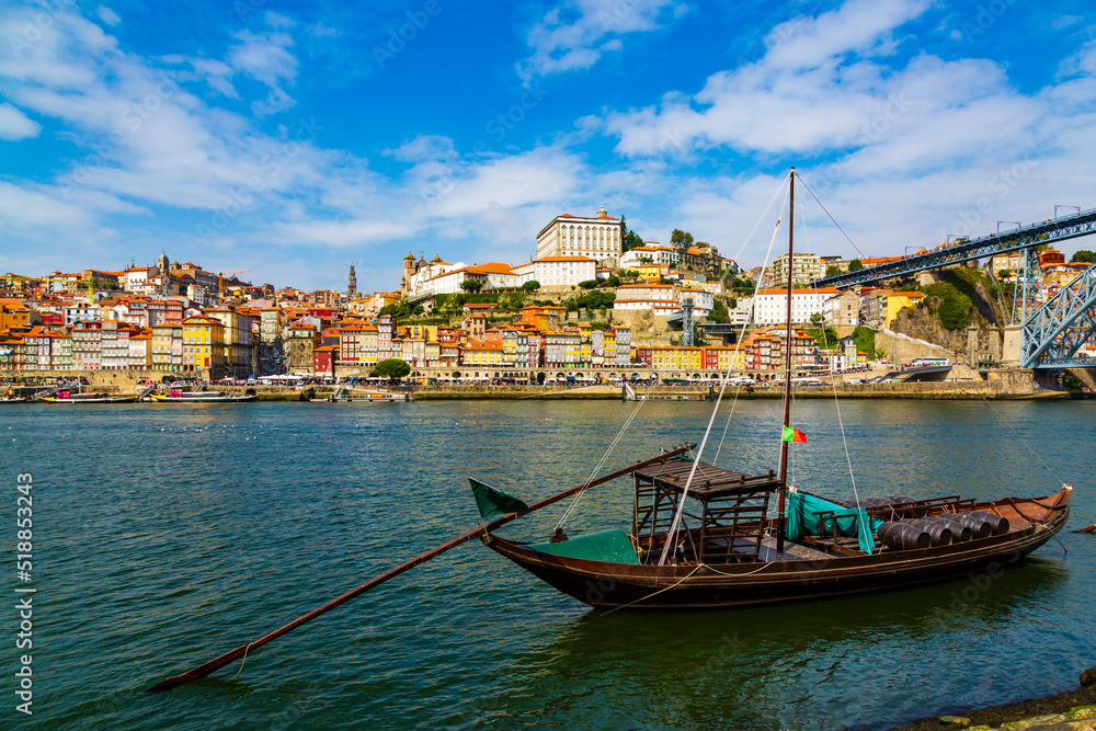 Porto, Portugal, old town cityscape and the Douro River with traditional Rabelo boats