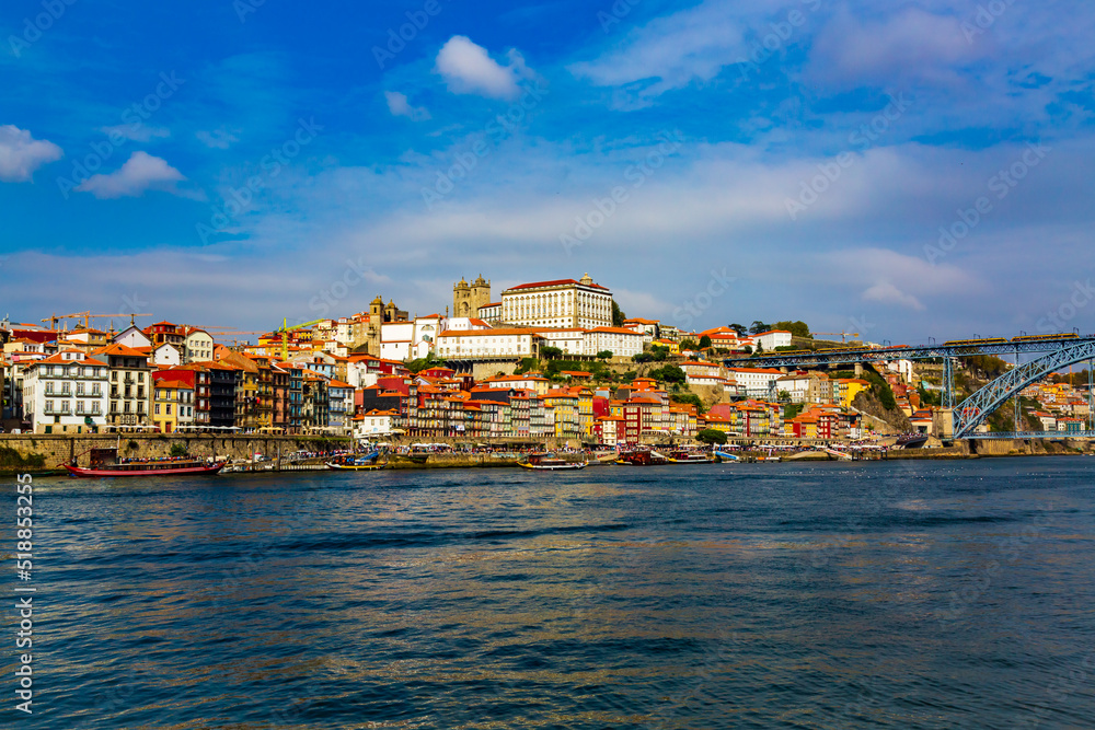 Porto, Portugal, Riberia old town cityscape with colorful houses and Dom Luis bridge, seen form Douro River