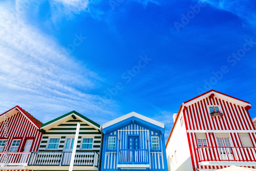 Costa Nova, Portugal: colorful striped houses called Palheiros located in beach resort on Atlantic coast near Aveiro.