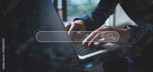 Data Search Technology, Search Engine Optimization (SEO). Man's hands using laptop computer to search the information on internet, online content