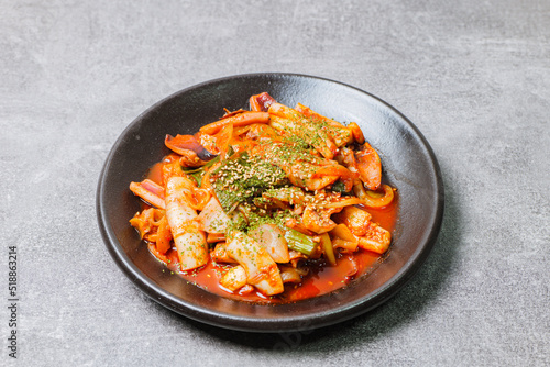 Korean food Stir-fried Squid, ojingeobokkeum : Squid stir-fried with onions, carrots, and cabbage in a spicy mixture of gochujang and red chili powder.