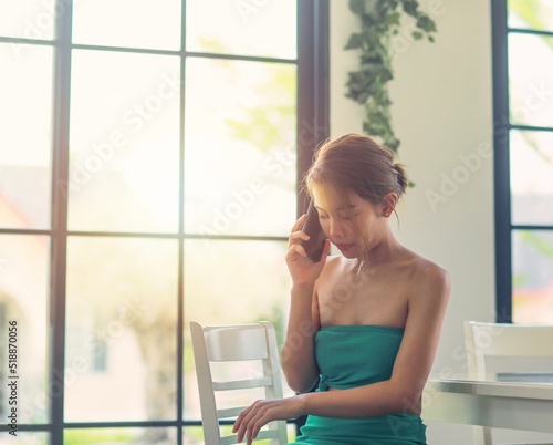 woman sitting and using smartphone for calling,technology and communication concept
