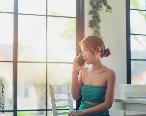 lady with dress using smartphone for calling,technology and communication concept