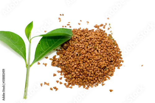 Mehendi or henna leaves and powder heap isolated on white background, Lawsonia inermis powder, Herbs for hair. photo