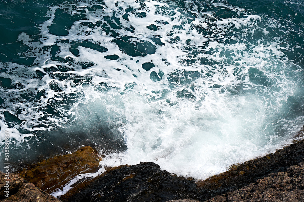 Rocky shore. Tidal bore. Ocean shore.