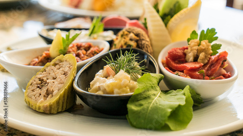 Small plates of vegetarian food, Turkish style meze on restaurant table