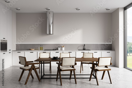 Front view on bright kitchen room interior with dining table © ImageFlow