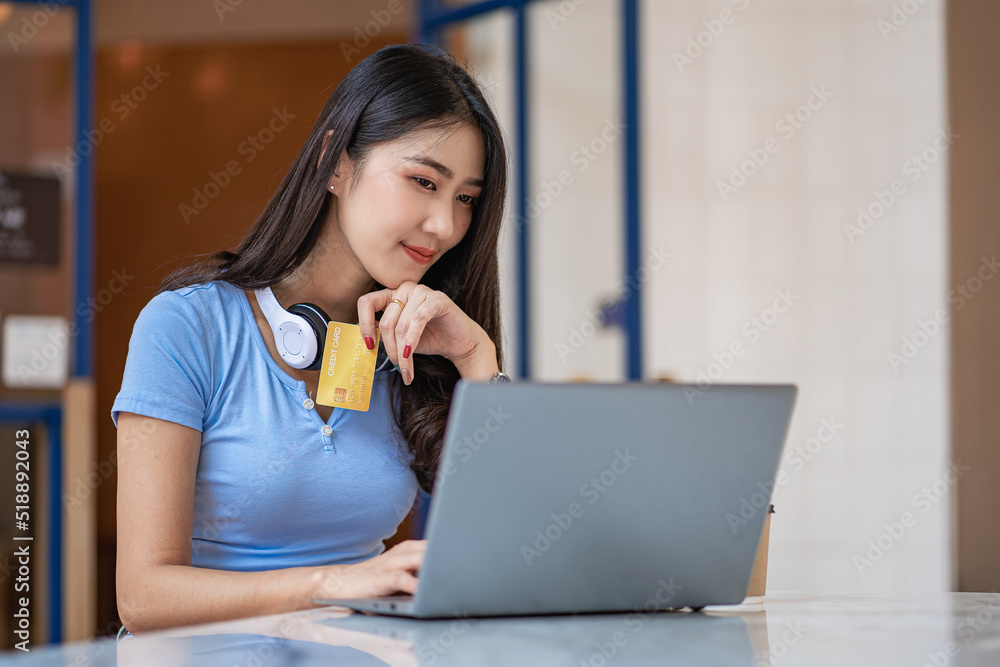 Asian women tend to shop online with laptops and credit cards and smartphones. Asian women tend to shop online with laptops and credit cards and smartphones.