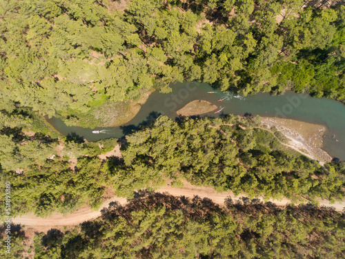 Birds eye view of sea kayakers paddling in the river