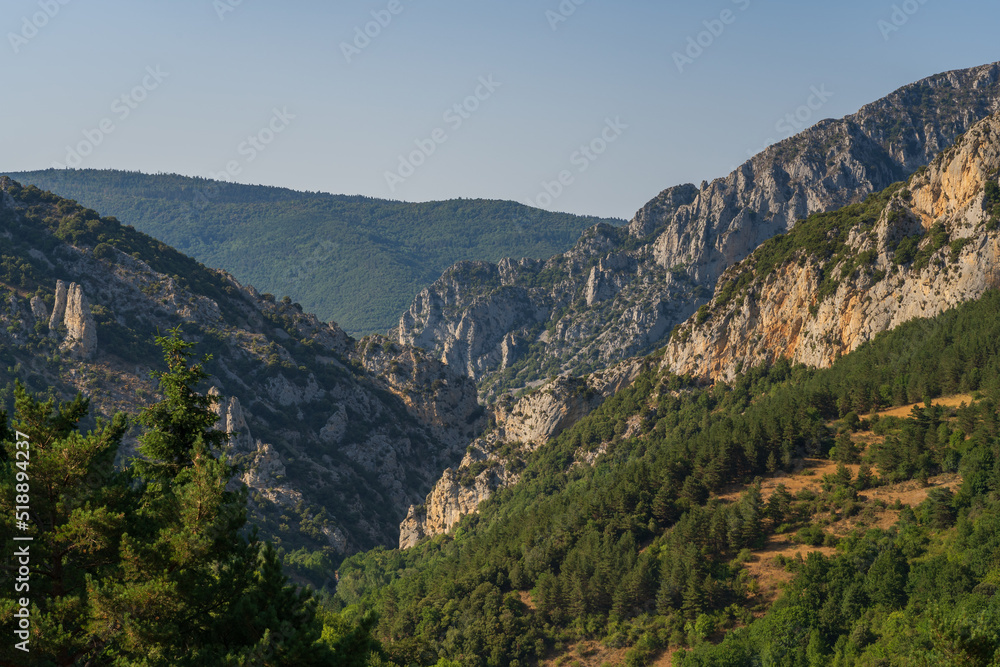Scenic late afternoon summer landscape of the Boulzane river valley in the French Pyrenees mountain range, Salvezines, Aude, France