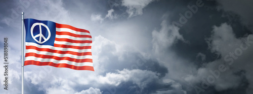 United States peace flag on a cloudy sky