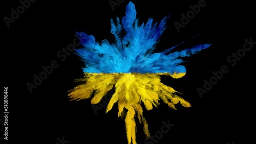 Colorful smoke powder explosion. Coloured yellow blue fluid ink particles forming a Ukraine flag in slow motion. Isolated closeup on black background. Alpha matte 4k. photo