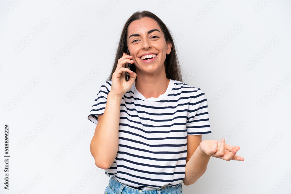 Young caucasian woman isolated on white background keeping a conversation with the mobile phone with someone Young caucasian woman isolated on white background keeping a conversation with the mobile phone with someone