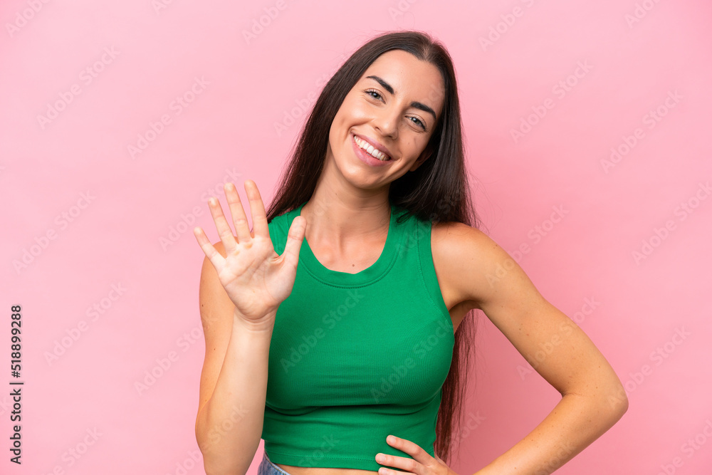 Young caucasian woman isolated on pink background counting five with fingers Young caucasian woman isolated on pink background counting five with fingers