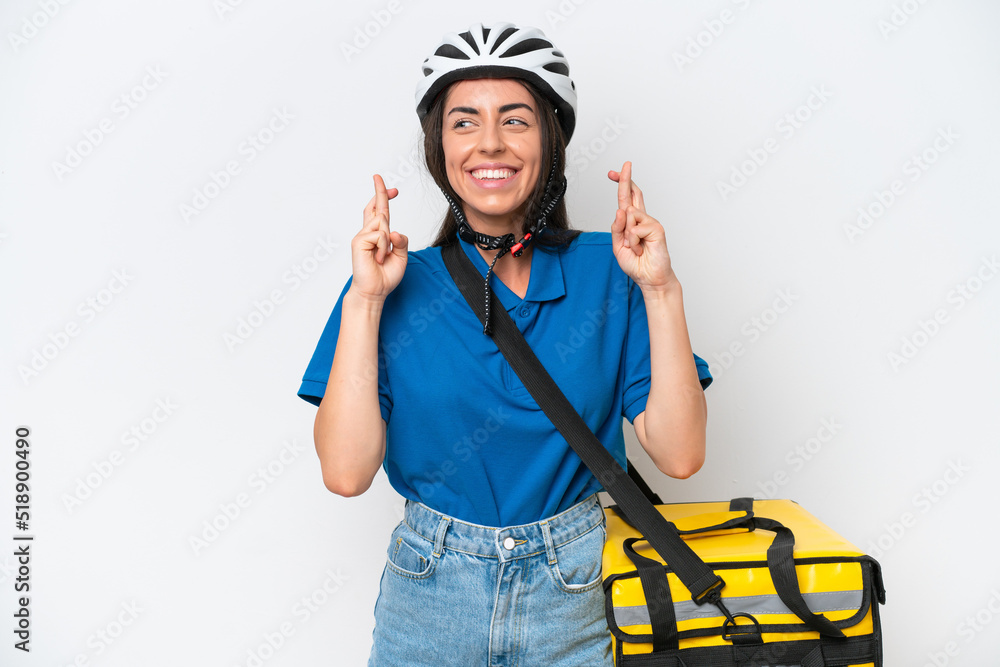 Young caucasian woman with thermal backpack isolated on white background with fingers crossing Young caucasian woman with thermal backpack isolated on white background with fingers crossing