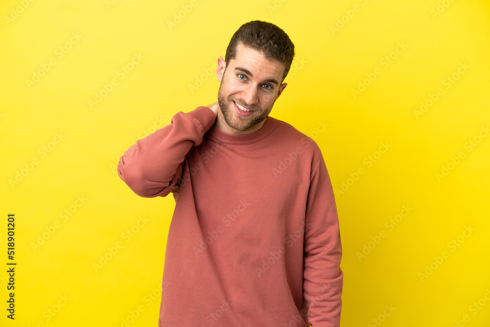 Handsome blonde man over isolated yellow background laughing Handsome blonde man over isolated yellow background laughing