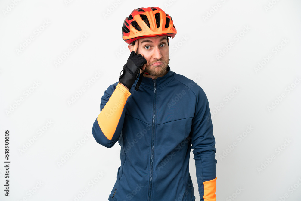 Young cyclist man isolated on white background thinking an idea Young cyclist man isolated on white background thinking an idea