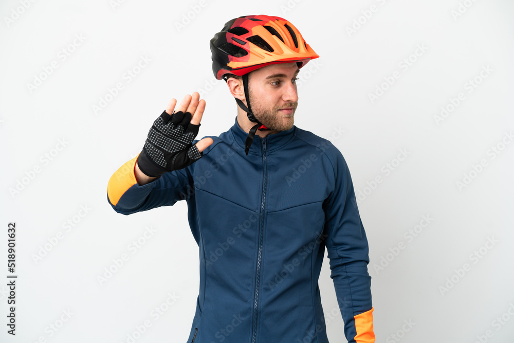 Young cyclist man isolated on white background making stop gesture and disappointed Young cyclist man isolated on white background making stop gesture and disappointed