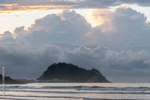 Getaria mouse at sunset with big clouds photo