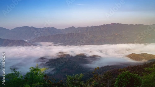 4K timelapse. scenic landscape of sky in wild misty nature with wave of low clouds blowing over decorate the beautiful scenery.