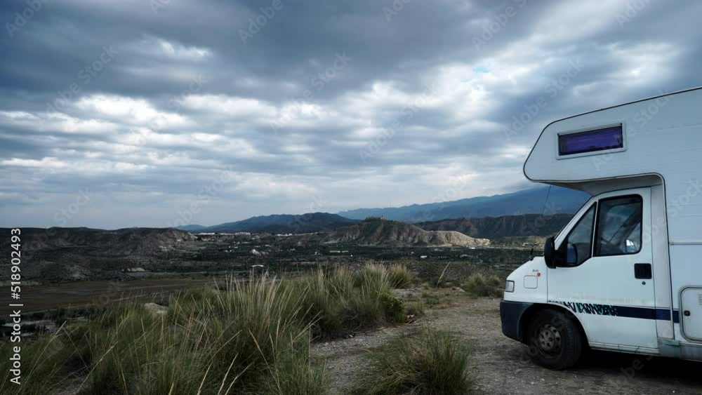 Time lapse of clouds moving over caravan camping on Tabernas desert landscape in Almeria, Spain. Movie location set for spaghetti western. Time lapse of clouds moving over caravan camping on Tabernas desert landscape in Almeria, Spain. Movie location set for spaghetti western.