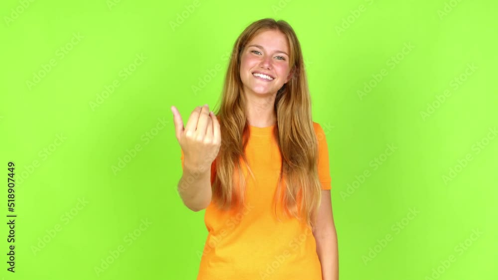 Young pretty blonde woman on green screen chroma key presenting and inviting to come with hand over isolated background Young pretty blonde woman on green screen chroma key presenting and inviting to come with hand over isolated background
