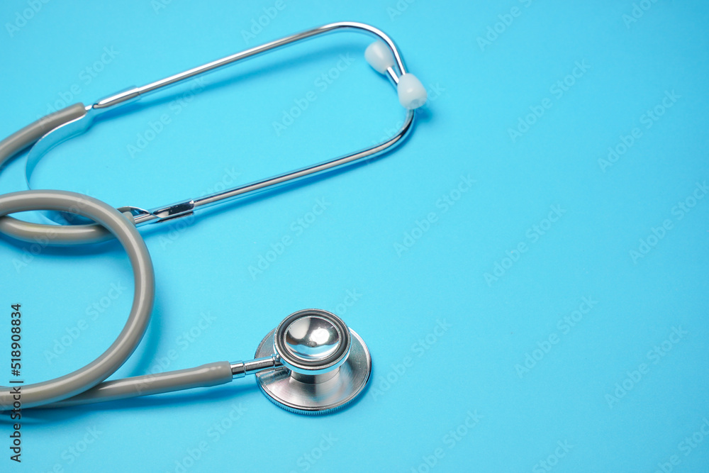 Stethoscope on blue background, Doctor using it. Medical equipment. Hospital, Stethoscope on blue background, Doctor using it. Medical equipment. Hospital,