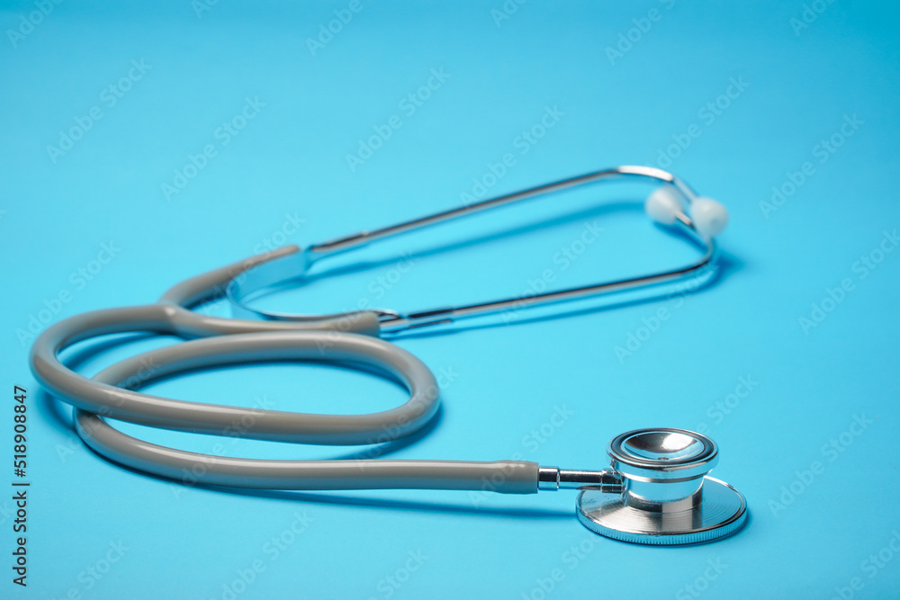 Stethoscope on blue background, Doctor using it. Medical equipment. Hospital, Stethoscope on blue background, Doctor using it. Medical equipment. Hospital,
