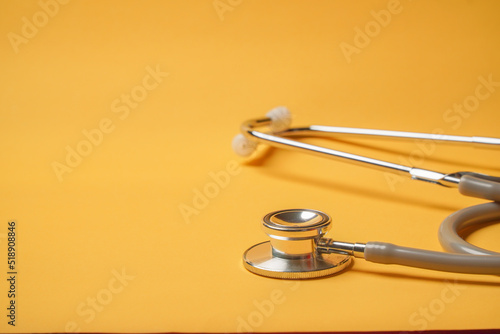Stethoscope on yellow background, Doctor using it. Medical equipment. Hospital,