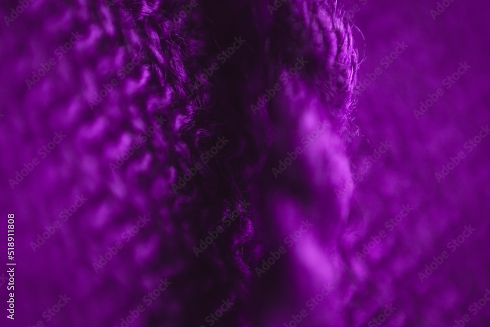 Fabric texture background of purple color (Very Peri). Close up of clothes as wallpaper.