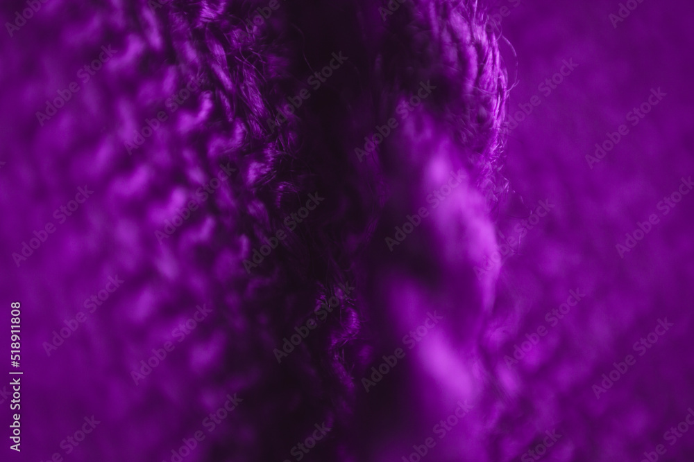 Fabric texture background of purple color (Very Peri). Close up of clothes as wallpaper. Fabric texture background of purple color (Very Peri). Close up of clothes as wallpaper.