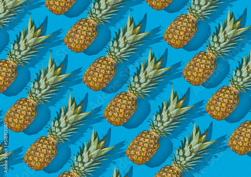 Pineapple fruit laying on light blue background