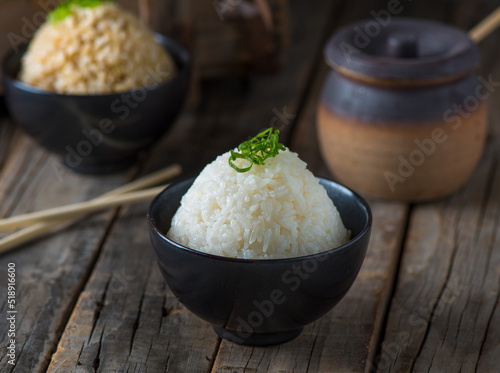 JAPANESE White RICE served in a dish isolated on wooden board side view.