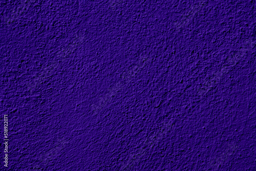 Purple colored abstract wall background with textures of different shades of violet