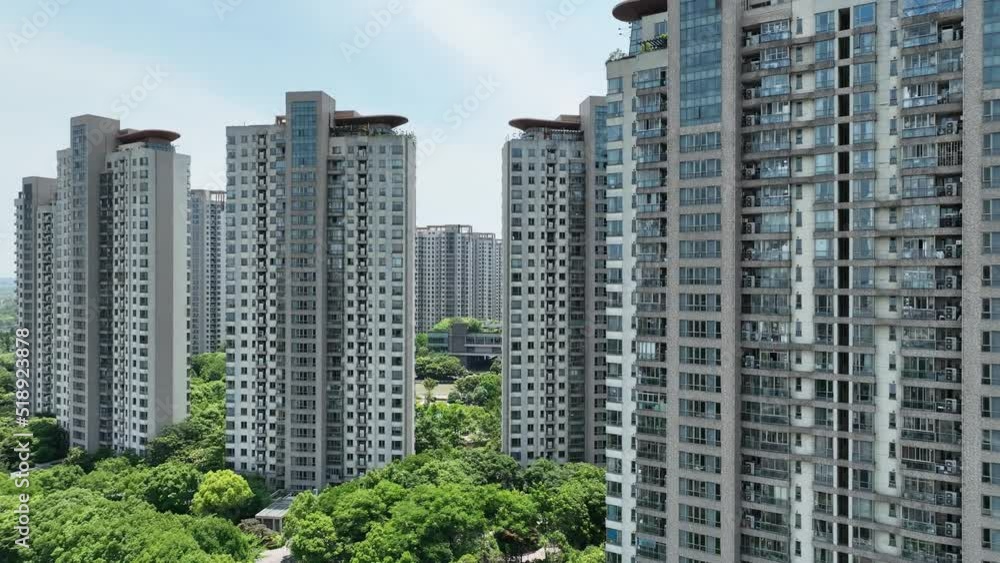 High apartment buildings in rows in sunny day. Drone aerial view. Skyscraper residential buildings in the city in Shanghai China. Economy, city scape, house development concept b-roll footage. High apartment buildings in rows in sunny day. Drone aerial view. Skyscraper residential buildings in the city in Shanghai China. Economy, city scape, house development concept b-roll footage.