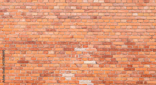 red old brick wall with gray joints