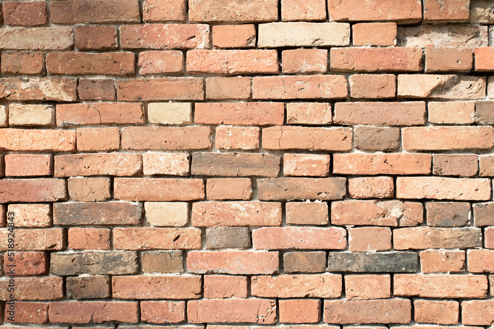 Obraz premium old brick wall in orange color with empty seams