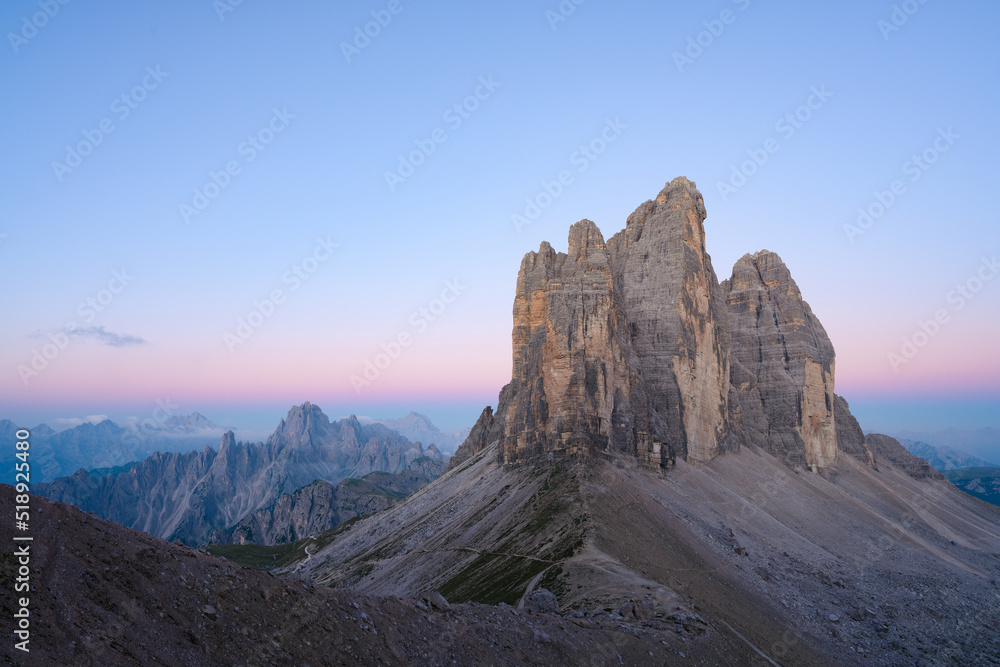 Stunning view of the Three Peaks of Lavaredo, (Tre cime di Lavaredo) during a beautiful sunrise. The Three Peaks of Lavaredo are the undisputed symbol of the Dolomites, Italy.