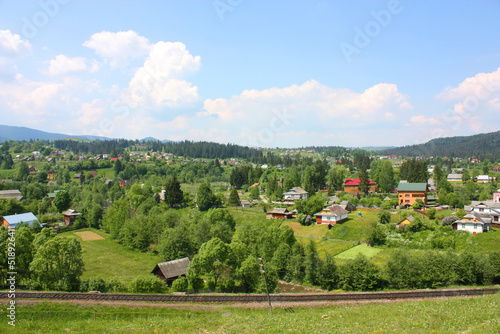 Landscape in the village Vorokhta with railroad in the Carpathian Mountains  Ukraine 