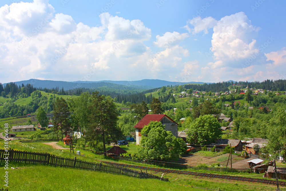 Landscape in the village Vorokhta with railroad in the Carpathian Mountains, Ukraine	
