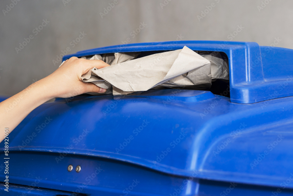 Paper Waste Recycling, Throwing Paper in Bin, recycling paper and separate waste collection concept Paper Waste Recycling, Throwing Paper in Bin, recycling paper and separate waste collection concept