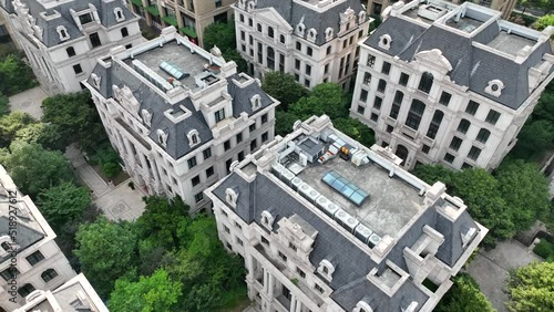 Houses in European style in the city. Drone aerial view. Rows of buildings of Victoria era style in the downtown area in Shanghai China.  Economy business, house development  concept b-roll footage.