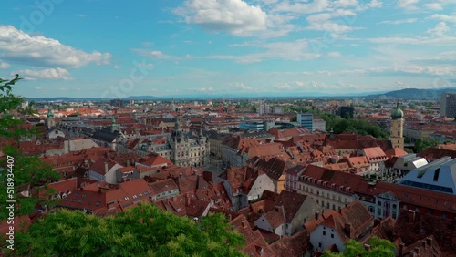 Aerial panorama view of Graz city old town from Castle Hill (Schlossberg) with historic buildings on a sunny summer day,  with blue sky cloud, Graz, Styria, Austria