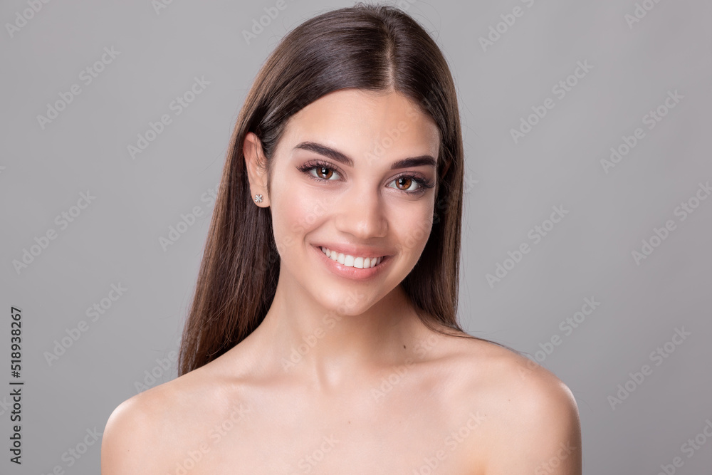Beautiful young woman with perfect skin. Portrait of beauty model with natural nude make up and touching her face. Spa, skincare and wellness. Close up, copyspace. Stock photo Beautiful young woman with perfect skin. Portrait of beauty model with natural nude make up and touching her face. Spa, skincare and wellness. Close up, copyspace. Stock photo