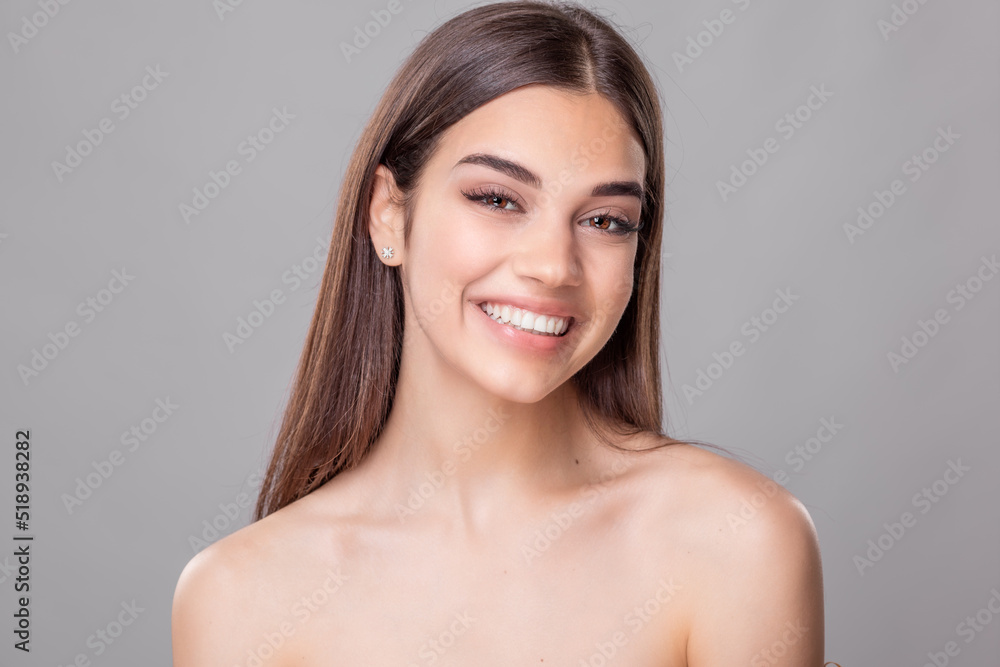 Beautiful young woman with perfect skin. Portrait of beauty model with natural nude make up and touching her face. Spa, skincare and wellness. Close up, copyspace. Stock photo Beautiful young woman with perfect skin. Portrait of beauty model with natural nude make up and touching her face. Spa, skincare and wellness. Close up, copyspace. Stock photo