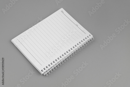 Notebook or organizer with blank page on gray background