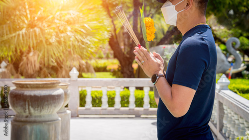 Ritual of burning incense sticks at the big Thai temple