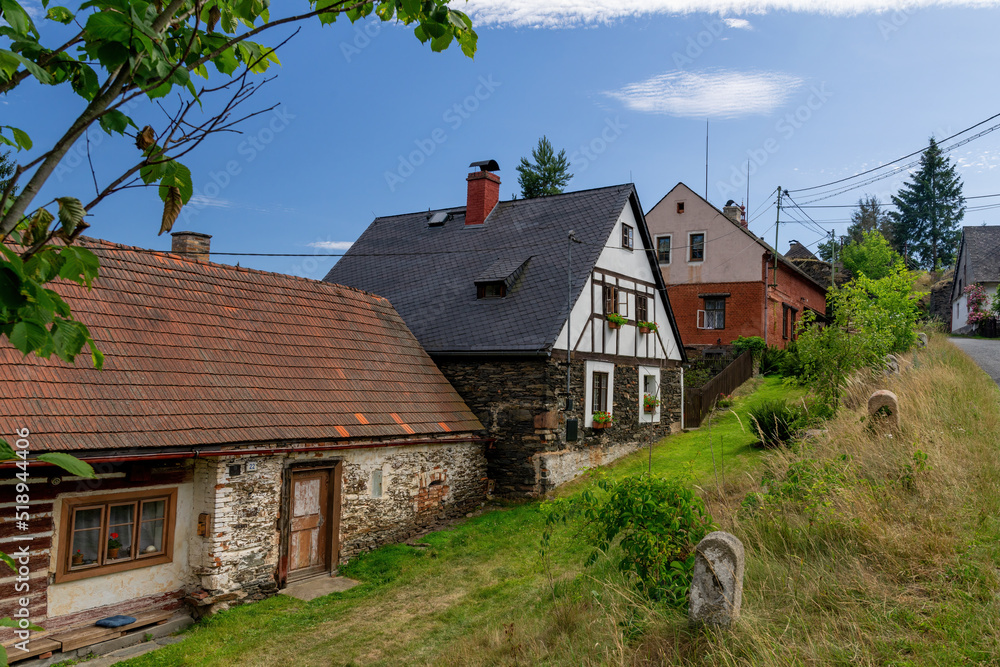 Obraz premium Set of folk houses with timbered and half-timbered architecture - small Czech historical city Rabštejn nad Střelou near Manětín in Region Plzeň - Czech Republic, Europe
