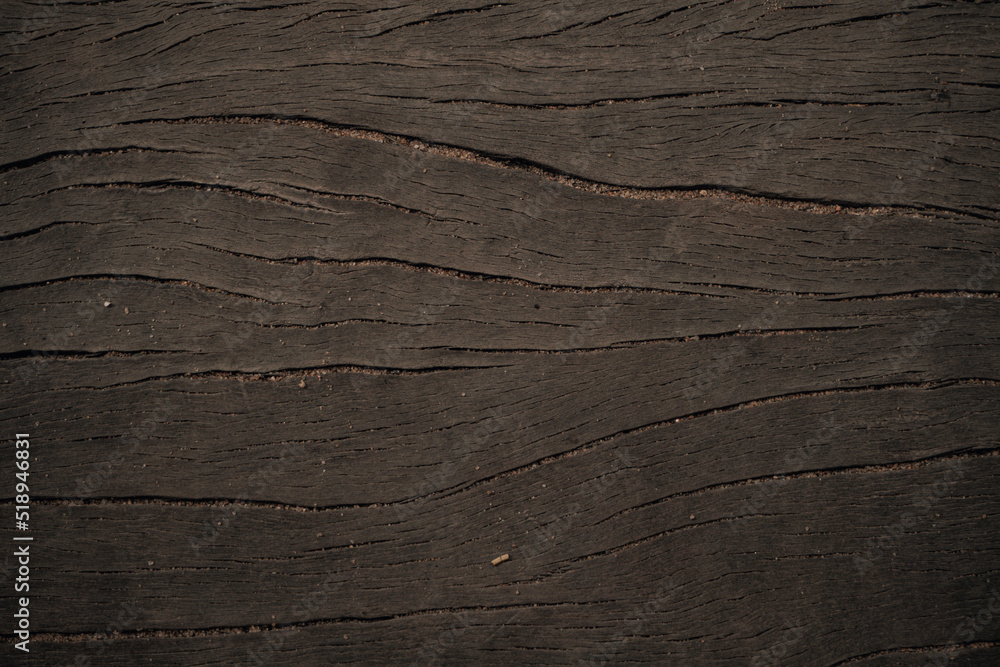 Dark wooden natural background, brown planks texture.