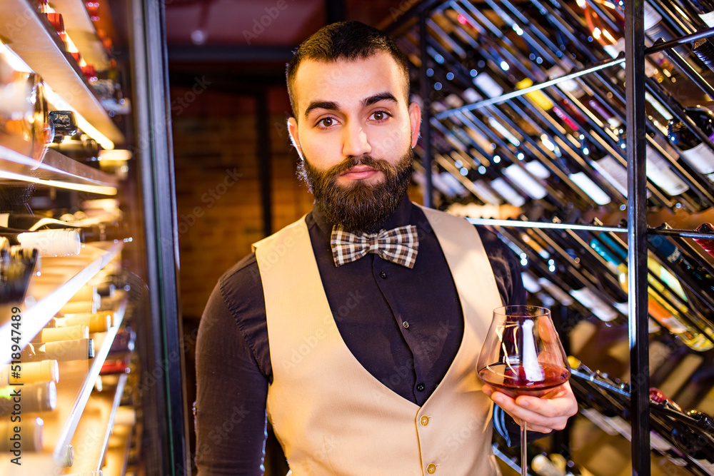 arabian man sommelier appreciating drink in lux hotel arabian man sommelier appreciating drink in lux hotel